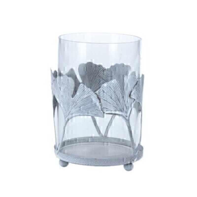 This Gingko leaf is bang on trend this season. These grey wash metal leaves with an antiqued finish trail around this glass tea light holder. Once lit a gentle illumination of the ginko leaf is silhouetted. Made by London based designer Gisela Graham who designs really beautiful gifts for your home and garden. It fits standard size tealight candles and would make an ideal gift. 